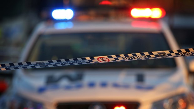 A man armed with a knife has threatened a female postal worker in Kingston at lunch time on Monday.
