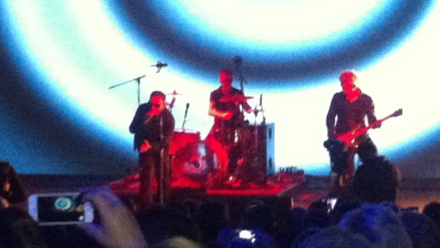 U2 perform on stage before releasing their new album for free on iTunes.