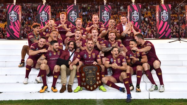 The victorious Queenslanders celebrate after State of Origin.