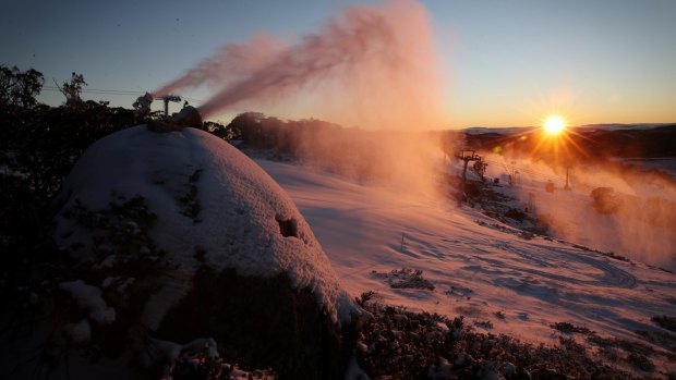 Dawn breaks at Perisher on Thursday as snow guns prepare for the opening of the season.