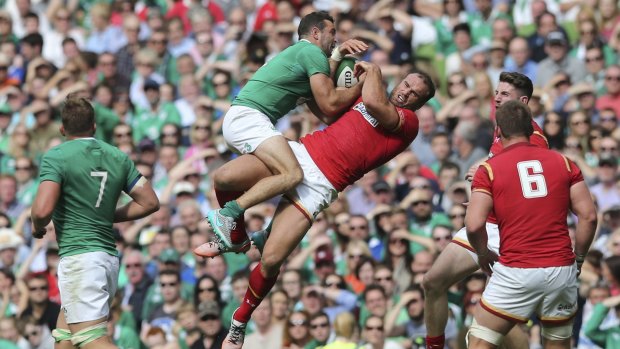 Dublin clash: Ireland's Dave Kearney and Wales' Jamie Roberts battle for the ball.