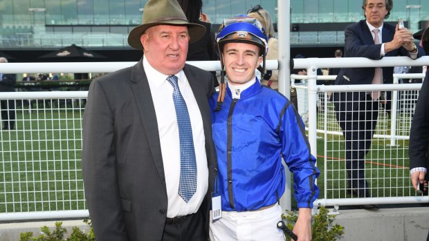 Happy chappies: Pat Webster and jockey Josh Adams celebrate the Tramway Stakes victory.