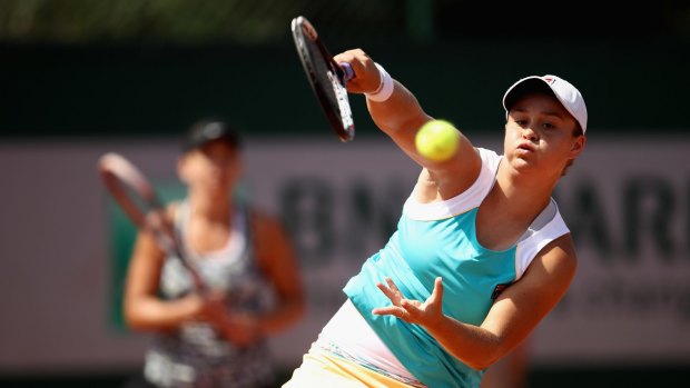 Ashley Barty and Casey Dellacqua (background) at the French Open.