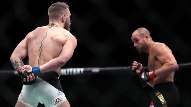 No contest: Conor McGregor, left, taunts Eddie Alvarez during the lightweight title fight.