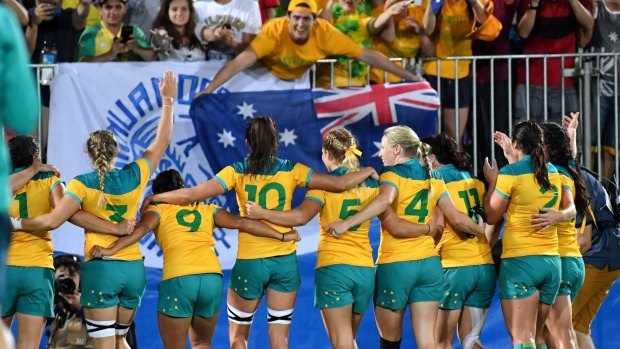 Australia's victorious rugby sevens team salute their fans after the final