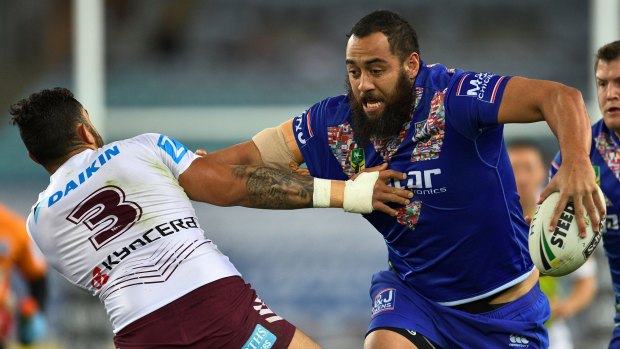 Wrecking ball: Sam Kasiano charges into Dylan Walker last season.