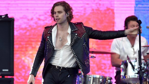 Luke Hemmings shows off his improved wardrobe at a gig in California this month.