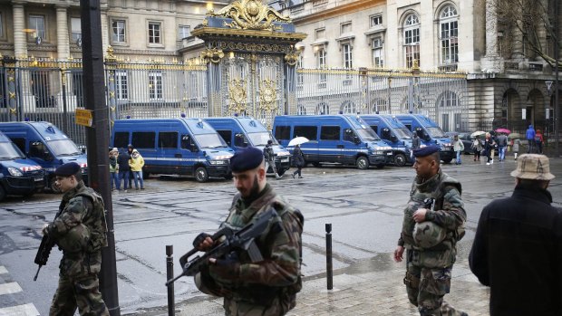 French soldiers patrol outside the Paris Hall of Justice on Wednesday while Reda Kriket is questioned inside. 