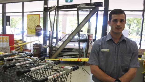 Woolworths Charnwood worker Peter Fisher said he was in the fruit and vegetable section near the entrance when he heard a loud smash and saw a car had crashed through the doors.