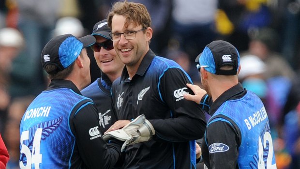 Teammates congratulate Daniel Vettori after he took a catch off his own bowling to dismiss Sri Lanka's Tillakaratne Dilshan.