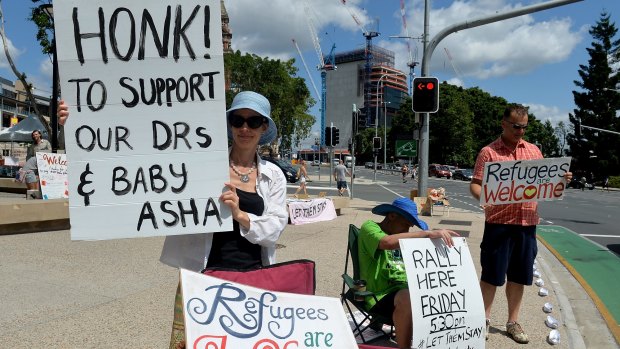 Protesters stand in solidarity with Lady Cilento hospital staff that are refusing to discharge baby Asha.