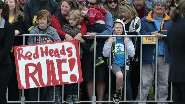 Ethan Toscan, 12, of Bruce with his sign "Redheads Rule" waits to meet Prince Harry at Australian War Memorial.