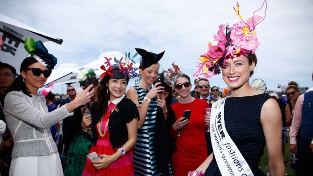 Emily Hunter was the winner of Fashions on the Field in a dark-navy-cum-black, full-skirted jacquard gown and extravagant headwear. 