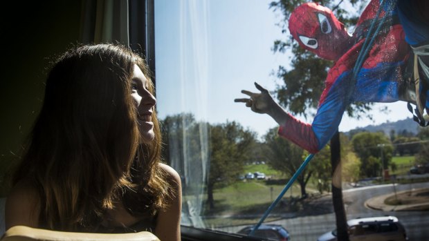 Kaylah Field, 12, gets a visit from Spiderman.