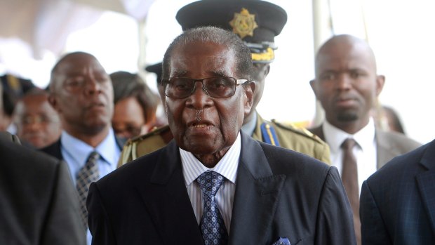 Zimbabwean President Robert Mugabe arrives to make his first public appearance, at a graduation ceremony on Friday, since the military put him under house arrest last week.