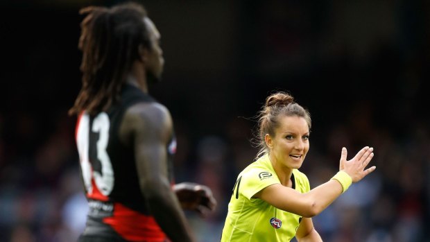 Eleni Glouftsis in action in her debut game as the AFL's first ever female field umpire.