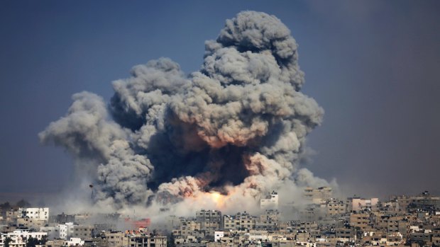 Smoke rises over Gaza City after an Israeli strike in July, 2014.