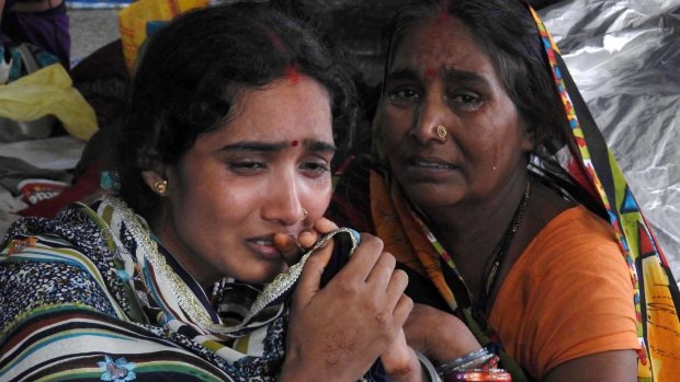 Relatives mourn the death of a child at the medical college hospital in Gorakhpur,.