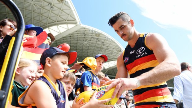 Potent: Taylor Walker will lead a star-studded forward line for Adelaide in the grand final.