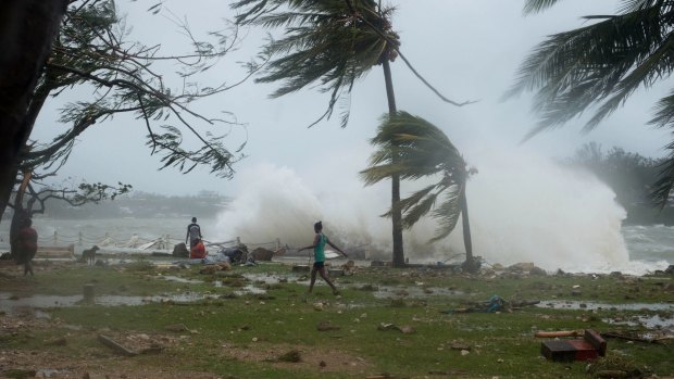Waves and scattered debris along the coast, caused by Cyclone Pam, in the Vanuatu capital of Port Vila. 