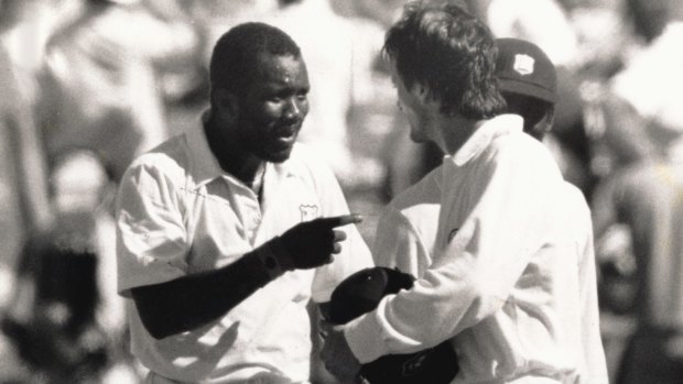 Early start: Steve Waugh and Malcolm Marshall exchange pleasantries in 1988-89.