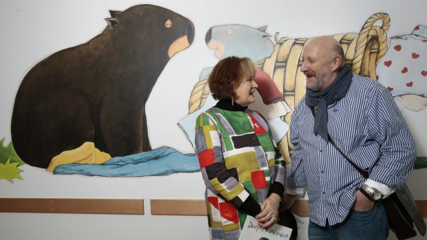 Author Jackie French and artist Bruce Whatley with one of the wombat images in the neonatal intensive care unit at the Centenary Hospital for Women and Children.  