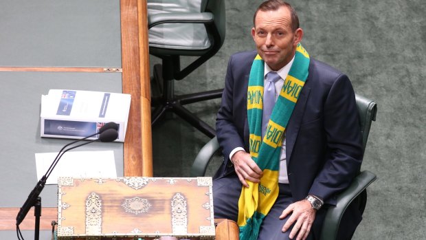 Prime Minister Tony Abbott, wearing the Australian Diamonds netball scarf, has called for more women to be pre-selected by the Liberal Party.
