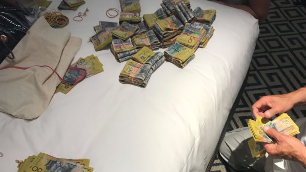 Police said they seized cash, a replica firearm, a sawn-off rifle and large quantities of drugs from properties after executing search warrants in several suburbs.