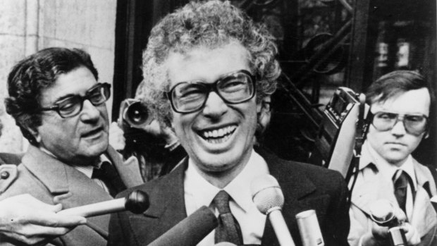 Then Canadian ambassador to Iran Ken Taylor laughs as he answers journalists questions journalists outside the Canadian embassy in Paris in 1980.