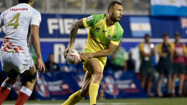 Quade Cooper of Australia carries the ball against Japan during the USA Sevens Rugby tournament.