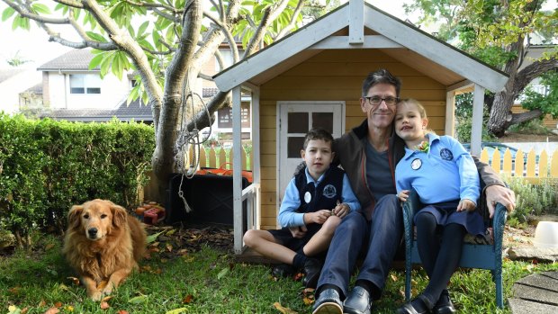 Chris Jolly and his children Oscar, 8, and Eloise, 6, at their Rozelle home. 