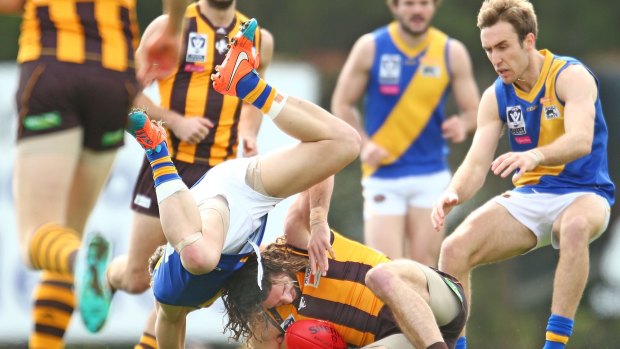Matthew Spangher of Box Hill is tackled by Mitch Banner of Wiliamstown during the round 20 VFL match on Sunday.