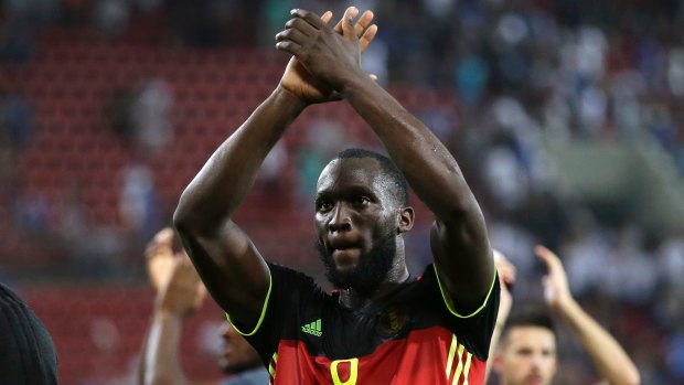 Job done: Belgium's Romelu Lukaku celebrates at the end of the World Cup group H match against Greece.