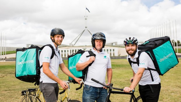 Deliveroo riders Hugh Bosman, Peter Baker, and Will Anderson. More than 50 riders have already signed up to deliver for the service, which is launching in Canberra.