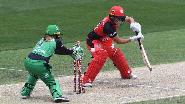 Beaten: Hayley Jensen, of the Renegades, is bowled by Georgia Elwiss in the Stars’ super-over win at the MCG. 