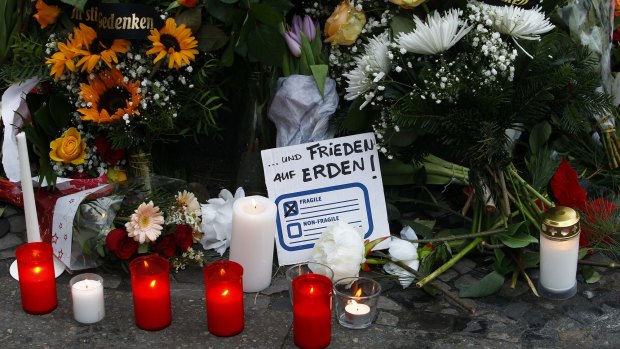 A message reading "Freedom on Earth" at a memorial for the victims of the Berlin terror attack.