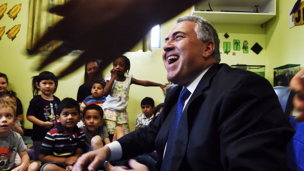 Child cheer: Joe Hockey at a Childcare centre in Padstow.
