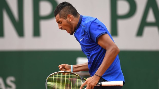 Nick Kyrgios shows his emotions during his first-round win at the French Open.