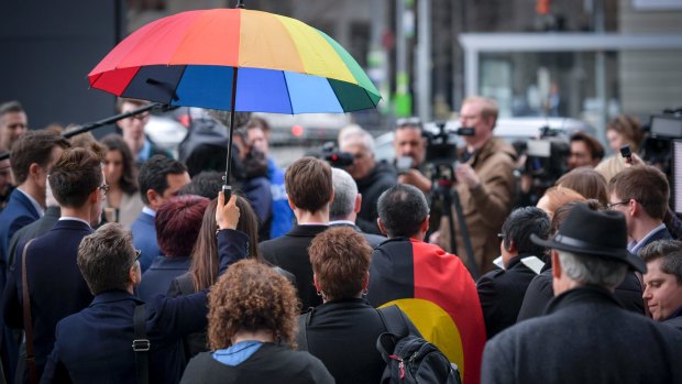 Same-sex marriage supporters address the media outside the High Court on 7 September 2017.