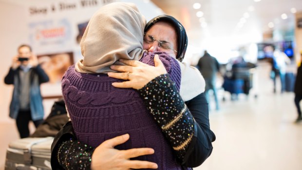 Sahar Harati, left, who moved from Iran to the US, embraces her mother as her parents arrive at Logan International Airport in Boston in early February.