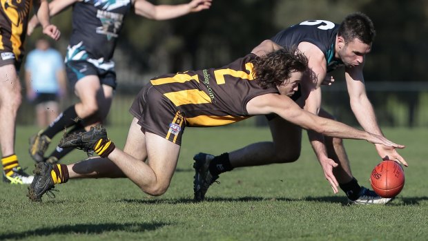 Tuggeranong's Aaron Ryan and Belconnen's James Bennett compete for the ball.
