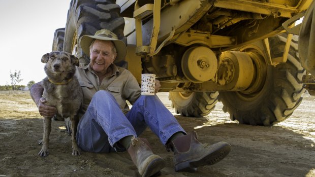 Lynn Cameron, 88, of Glenferrie Station, with his grader, used to clean up his station tracks with a bit of help from his oldest dog, Pepper. 