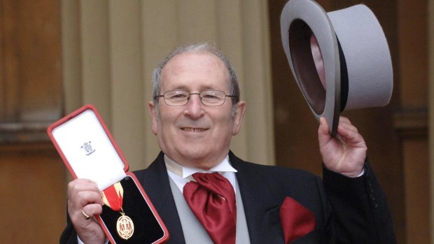 British playwright Arnold Wesker poses after being knighted at Buckingham Palace in February 2006. 