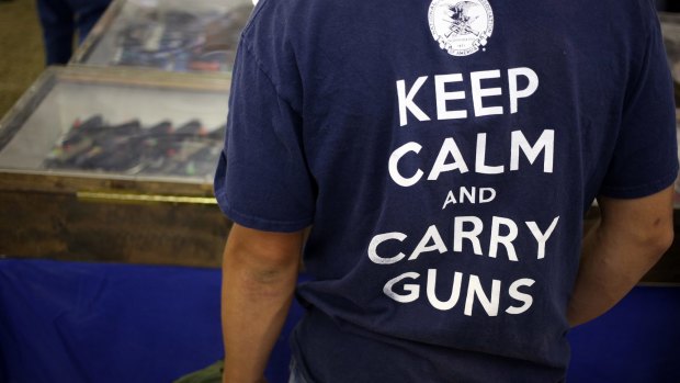 A pro-gun supporter sports a National Rifle Association T-shirt.