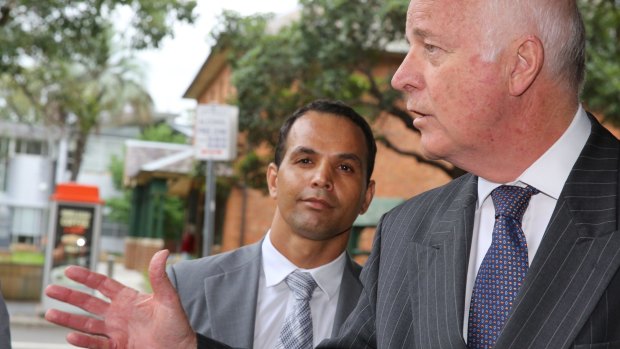 Businessman Savas Guven with his barrister Stuart Littlemore outside Parramatta Local Court on Thursday.