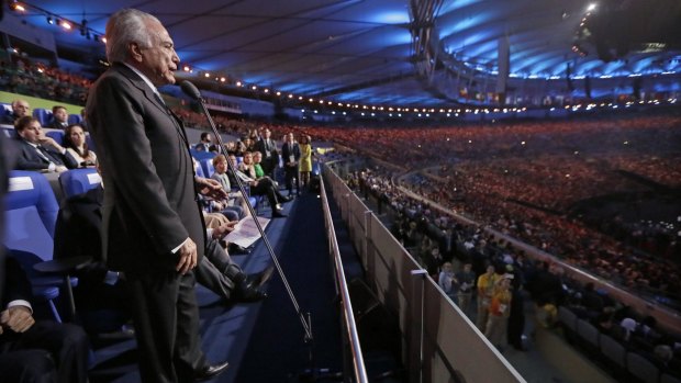 Extra brief appearance to avoid the vaia: Brazil interim President Michel Temer opens the 2016 Summer Olympics.