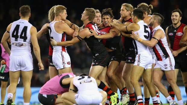 Saints players wrestle with Mark Baguley of the Bombers after the incident with Jack Lonie on Sunday.