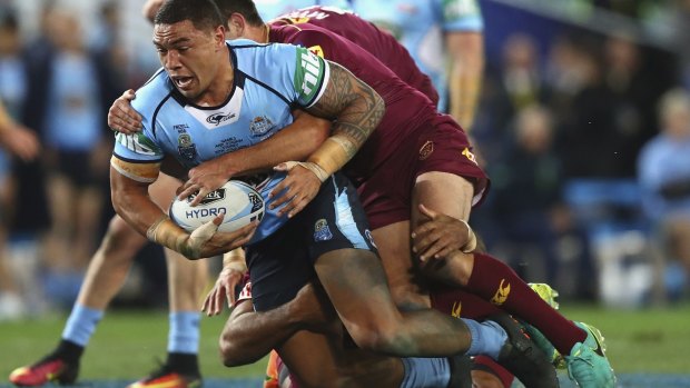 Top show:  Blues forwrad Tyson Frizell is tackled during game three of the State Of Origin series between NSW and the Queensland Maroons at ANZ Stadium.