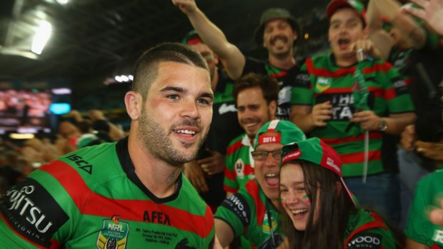 Reason to smile: Adam Reynolds  celebrates with the crowd after victory in the 2014 grand final against Canterbury.