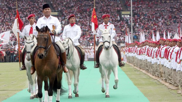 Opposition leader Prabowo Subianto, left, has been approached by Indonesian President Joko Widodo in an appeal for calm ahead of Friday's protest. 